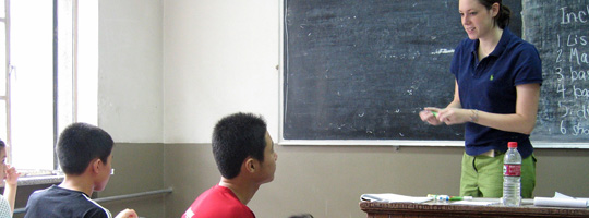 A teacher addresses her class